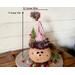 This is a handmade Christmas elf made with a real dried gourd. Including his elf hat, he is 9 inches tall and 4.5 inches wide. 